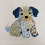 An applique of a patchwork Puppy with zigzag stitches by snugglepuppyapplique.com