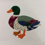An patchwork applique of a mallard duck by snugglepuppyapplique.com