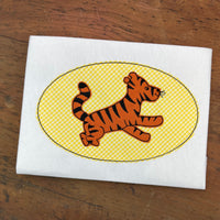 A bean stitch applique of classic Tigger from Winnie the Pooh by snugglepuppyapplique.com