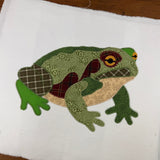 An applique of a toad in patchwork by snugglepuppyapplique.com