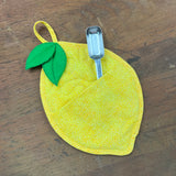 An in the hoop  Lemon shaped potholder, insulated and quilted design by snugglepuppyapplique.com