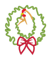 An applique design of a rooster with his head through a Christmas wreath by snugglepuppyapplique.com
