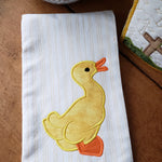 An applique of a duck with his bill open by snugglepuppyapplique.com