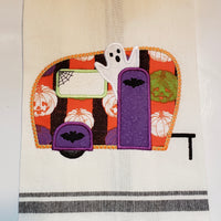 An applique of a camper with a ghost, spiders web and bats by snugglepuppyapplique.com