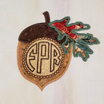 an applique of an acorn with place to put a monogram by snugglepuppyapplique.com