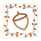 An in the hoop Autumn Coaster with an Acorn in the center and a boarder of twigs and fall leaves by snugglepuppyapplique.com