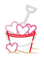 An applique of a bucket full of hearts and a shovel by snugglepuppyapplique.com