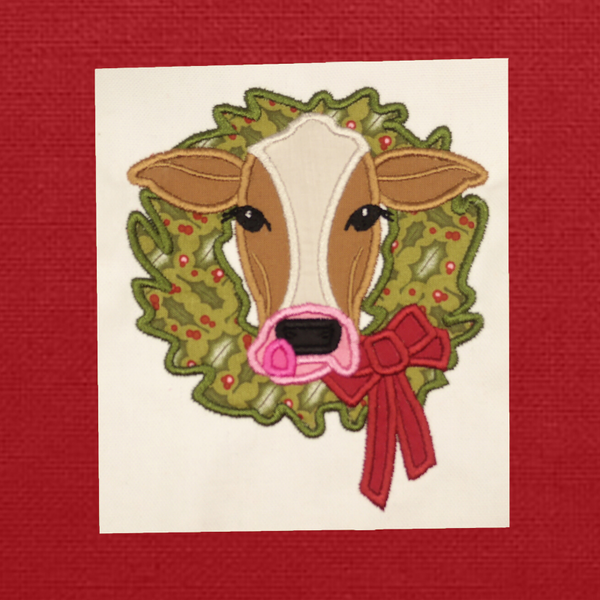 Cow with a wreath Christmas Applique Embroidery Design by snugglepuppyapplique.com