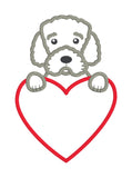 An applique of a curly haired Portuguese Water Dog with paws on a heart by snugglepuppyapplique.com  Edit alt text