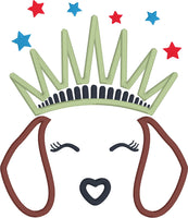 An applique of dachshund ears, nose and closed eyes  with lashes wearing a statue of liberty crown with embroided stars above, by snugglepuppyapplique.com