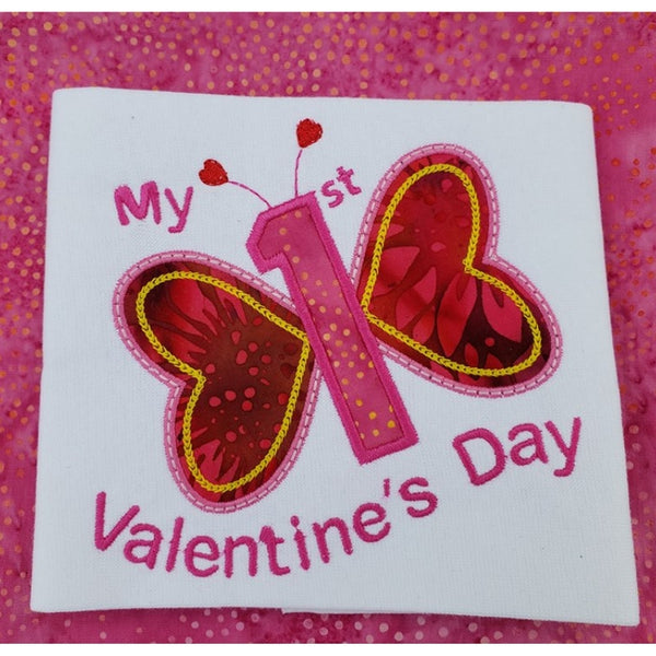 baby's first Valentine's Day applique embroidery design.  Butterfly with heart wings and a number one as it's body, snugglepuppyappliuqe.com