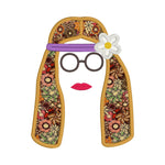 An applique of a hippy woman with a headband and flower and round glasses by snugglepuppyapplique.com