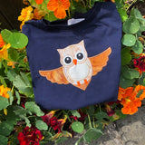 An applique of an owl flying by snugglepuppyapplique.com