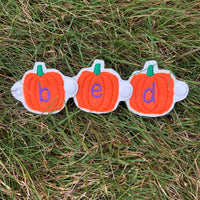 In the hoop Ghosts with upper case letters and Pumpkins with lower case letters. Both snap together to create words by snugglepuppyapplique.com