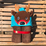 A reindeer peeker applique embroidery design on a hooded towel by snugglepuppyapplique.com