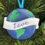 Earth Ornament with a banner that has "love" embroidered on it.