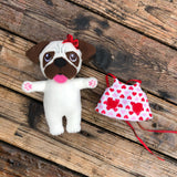 In the hoop Pug stuffie with bow and dress by snugglepuppyapplique.com