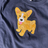 an applique of a Welsh Corgi puppy with his tongue out by snugglepuppyapploque.com