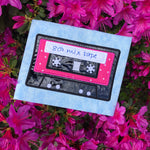 An applique of a cassette tape by snugglepuppyapplique.com