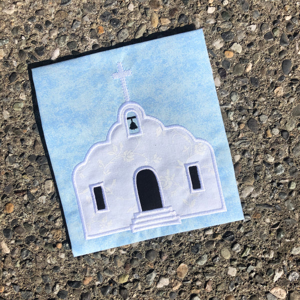 An applique of an adobe Mission by snugglepuppyapplique.com