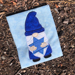 An applique of a Gnome holding the star of David by snugglepuppyapplique.com