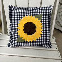 an applique of a sunflower with a zig-zag applique stitch by snugglepuppyapplique.com  Edit alt text
