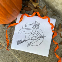 A vintage bean stitch of a sexy witch riding a broom embroidery design by snugglepuppyapplique.com