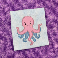 An applique of a babyish looking octopus by snugglepuppyappliquecom
