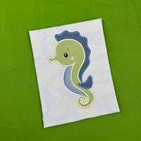 A nautical applique design of a seahorse by snugglepuppyapplique.com