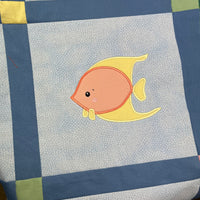 An applique of an angelfish with cute eyes by snugglepuppyapplique.com