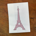 A bean stitch applique with motif fill of the Eiffel Tower by snugglepuppyapplique.com
