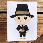 Pilgrim boy applique embroidery design, stylized with large head, holding a turkey drumstick with a bit taken out