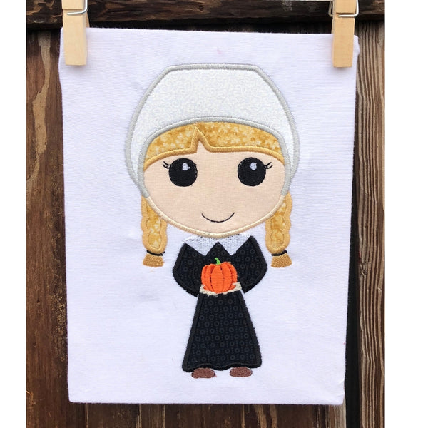 Pilgrim Girl applique embroidery design, stylized with large head holding a tiny pumpkin 