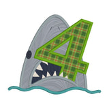 An applique of a shark biting the number 4 by snugglepuppyapplique.com