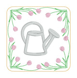 An in the hoop spring coaster with a watering can in the center and a boarder of tulips by snugglepuppyapplique.com