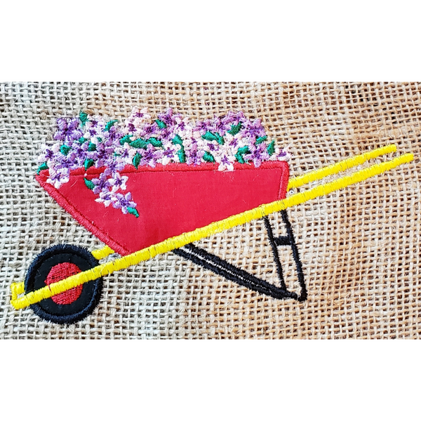 wheelbarrow of Petunias applique embroidery design, snugglepuppyapplique.com