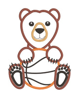 An appliqué of a bear holding a basketball by snugglepuppyapplique.com