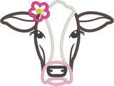 Cow applique embroidery design, cows face only with flower behind right ear, snugglepuppyapplique.com
