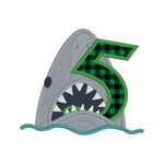 An applique of a shark biting the number five by snugglepuppyapplique.com